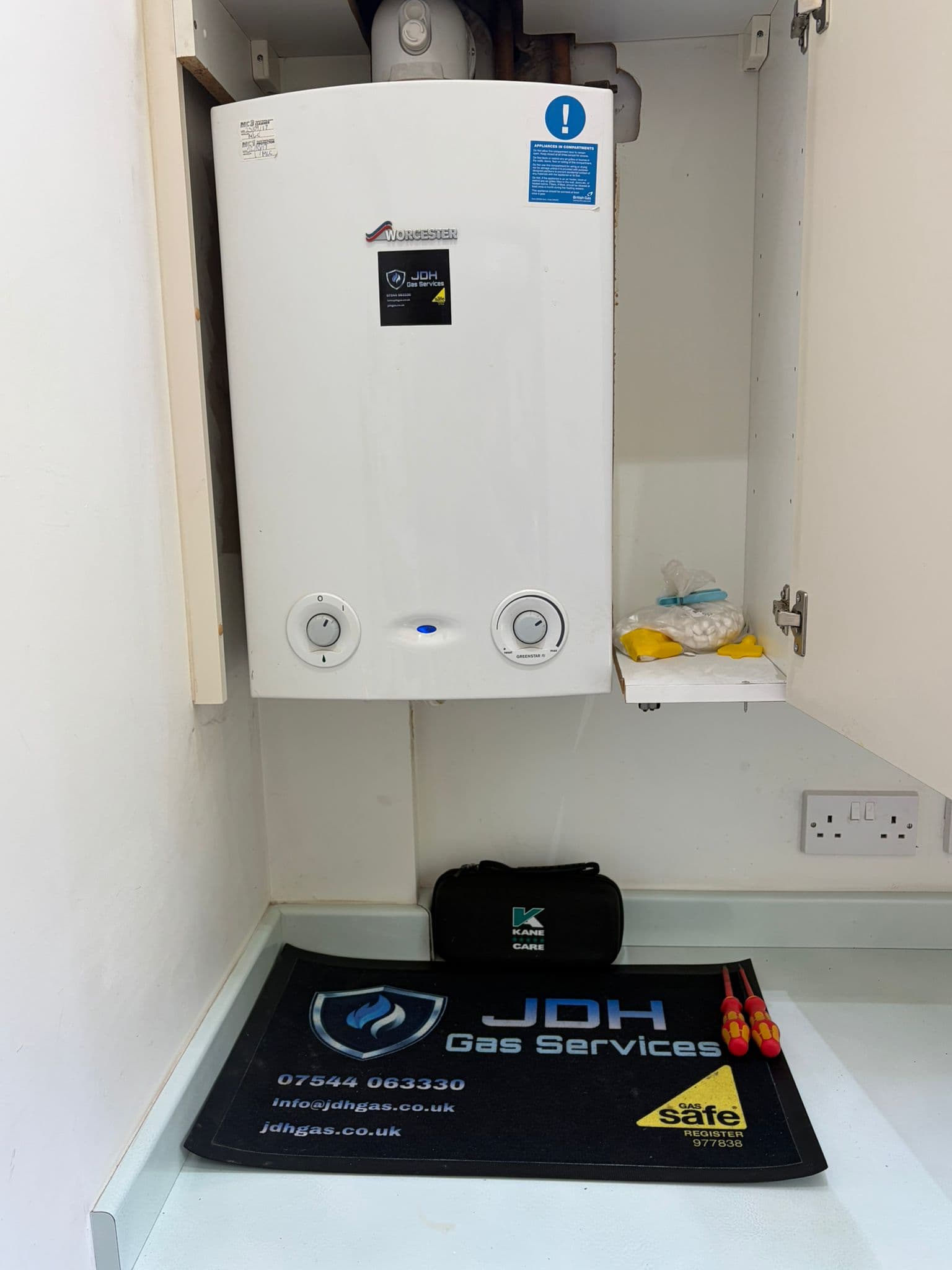 A Worcester boiler freshly serviced by JDH Gas, with the Gas Safe registered mat laid out