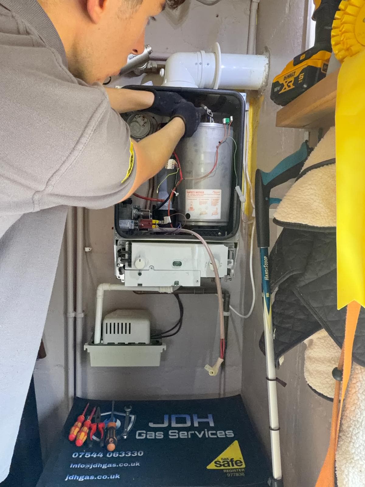 Jamie Hannah, Gas Safe registered engineer covering Wivelsfield, servicing the internals of an open Worcester boiler