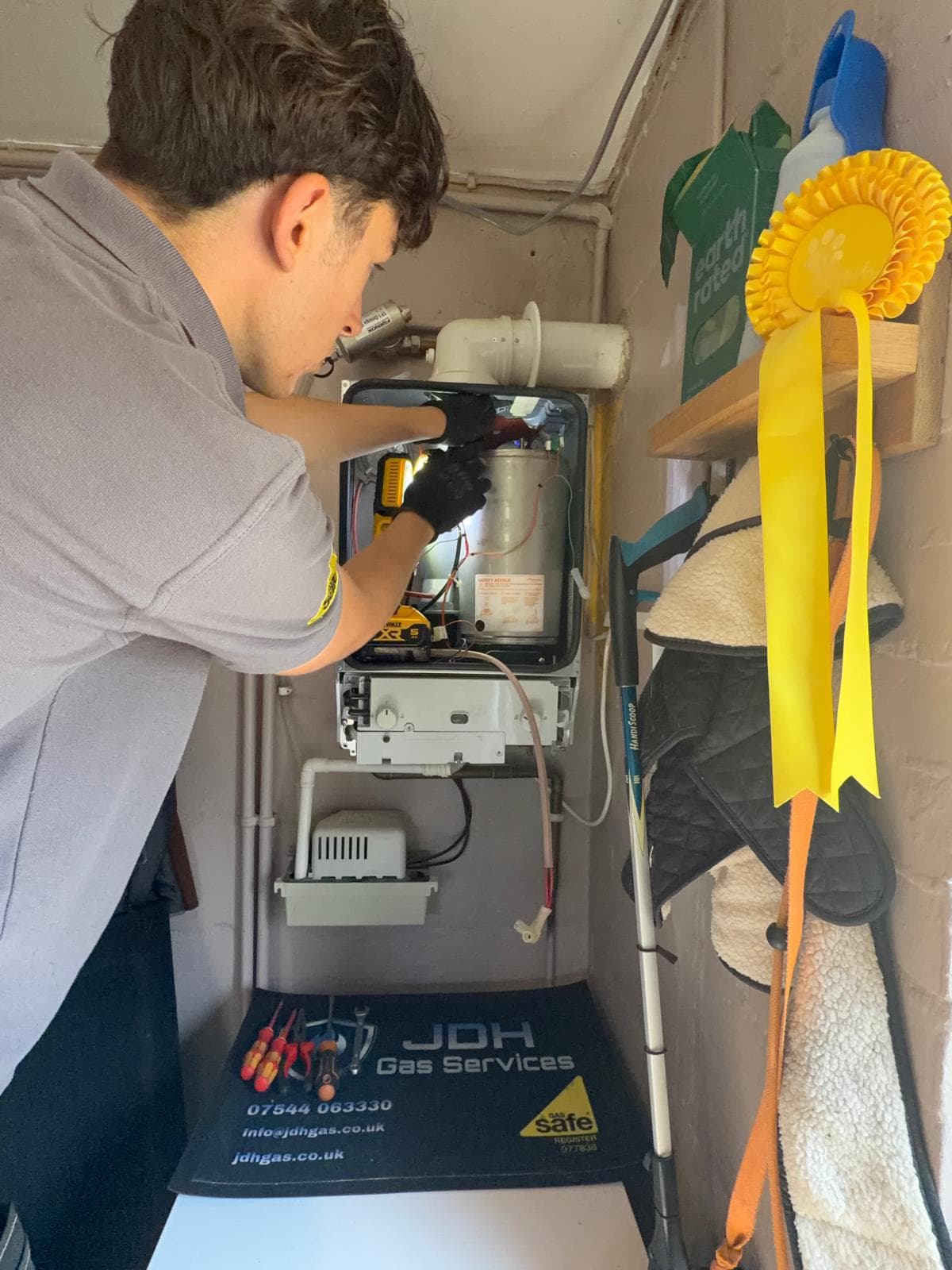 Jamie Hannah, Gas Safe registered engineer covering Keymer, working on an open Worcester boiler during a service